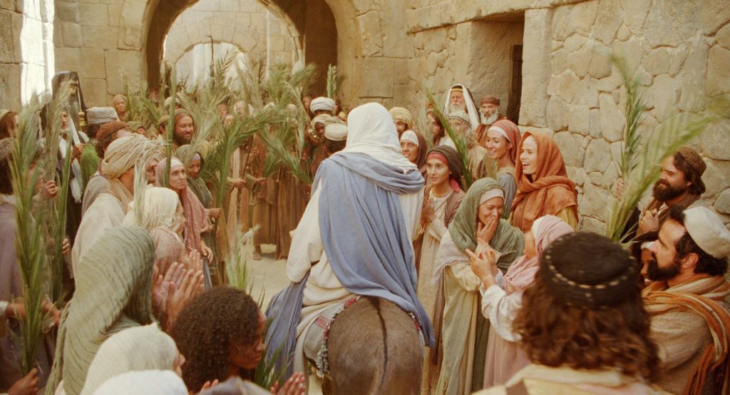 Jesus rides into Jerusalem