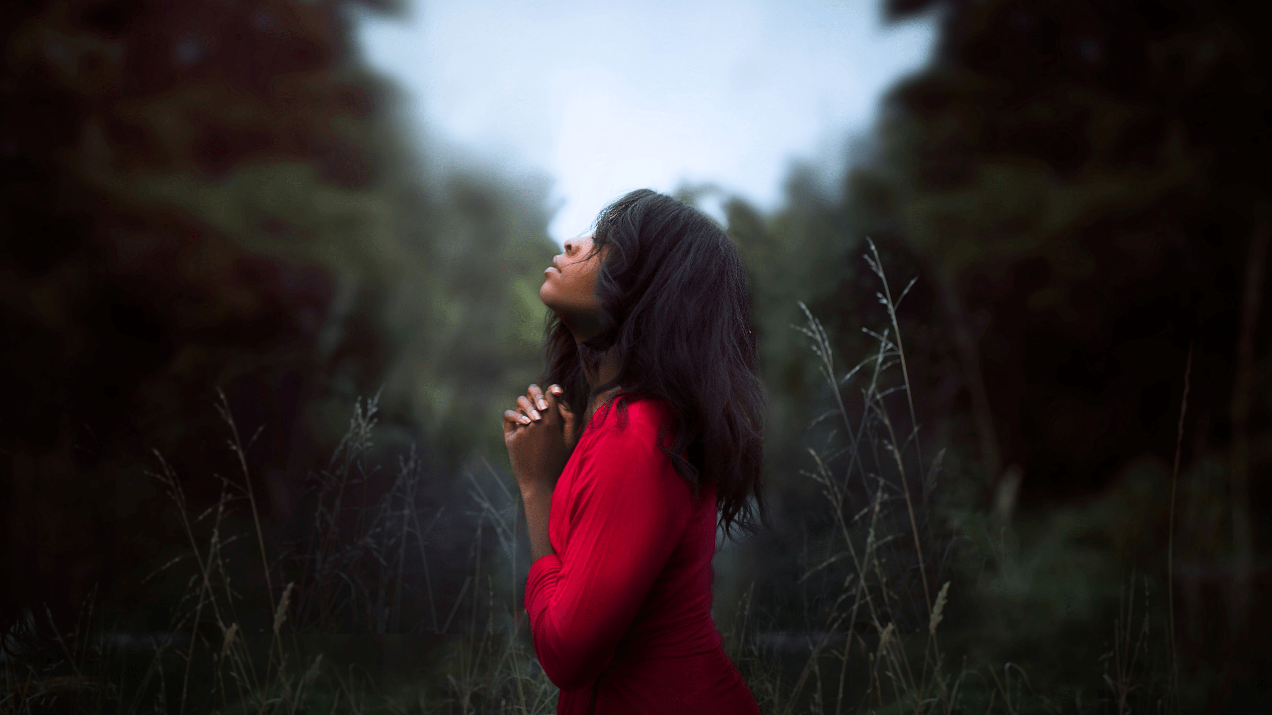 woman looking up to God praying